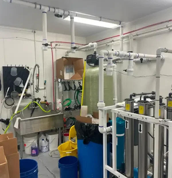 Commercial mechanical room with banked filtration and overhead piping
