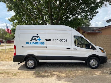 A+ Plumbing branded Transit van in a residential driveway