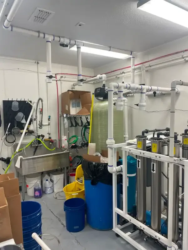 Commercial mechanical room with banked filtration and overhead piping