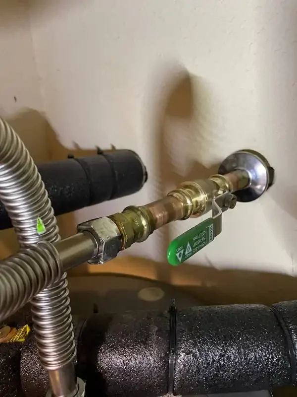 Gas flex connector and union fitting at an appliance tie-in