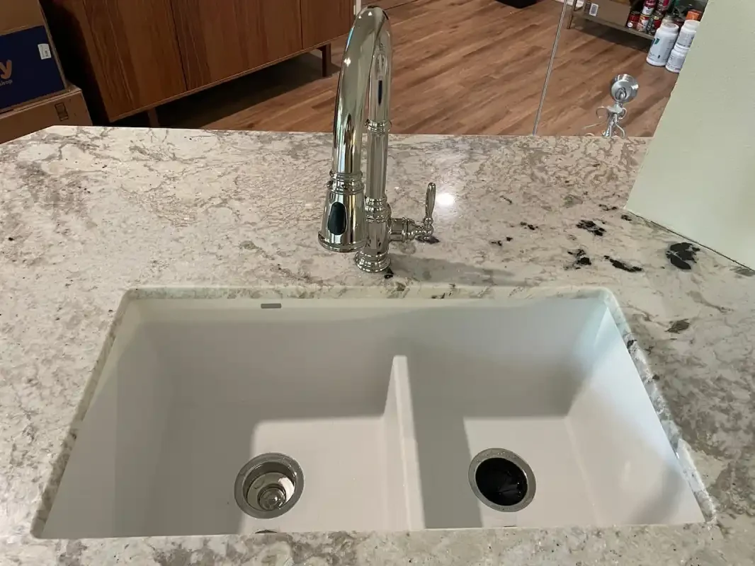 Undermount double-bowl sink in a granite counter