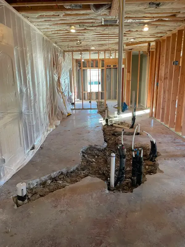 Drain rough-in stubs in an open slab during a remodel