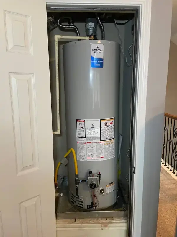 Gas water heater in a closet with yellow flex connector